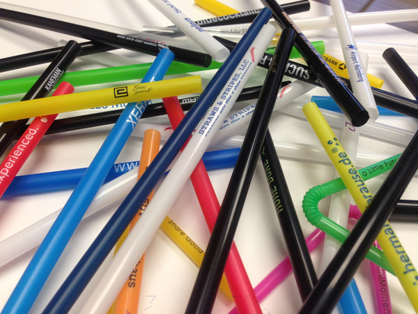 Assorted colored drinking straws personalized with logos and text